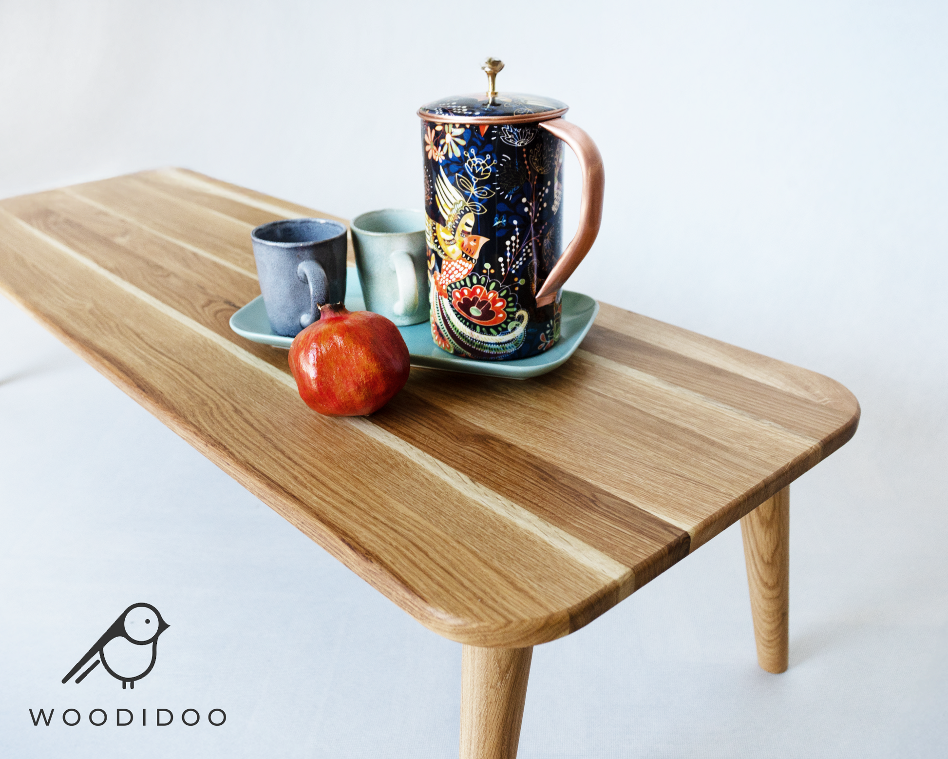 Minimalist handcrafted oak table with traditional Japanese design.